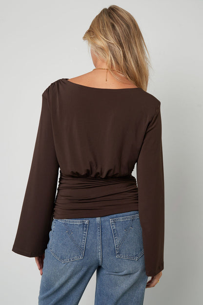 Shirt fitted with flared sleeves